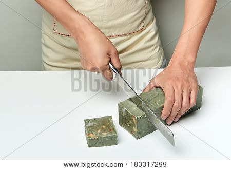Man Cutting A Handmade Soap With A Knife