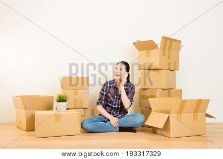 Girl Using Smartphone Sitting On Boxes