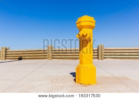 Fire fighters high pressure water hydrant yellow painted valve .