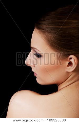 Attractive blonde topless woman with dark make up