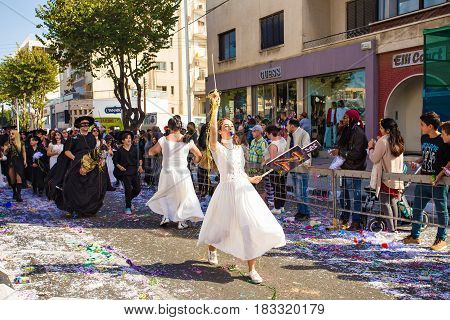 LIMASSOL, CYPRUS - FEBRUARY 26: Grand Carnival Parade - an unidentified people of all ages , gender and nationality in colorful costumes during the street carnival