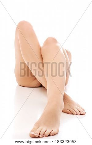 Nude woman lying on the floor