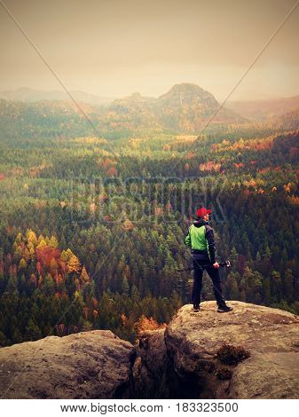 Photographer Working With Mirror Camera And Tripod On Peak Of Rock. Dreamy Fogy Landscape