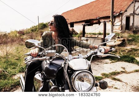 Beautiful Motorcycle Brunette Woman With A Classic Motorcycle (cinema Bleach Bypass Effect)