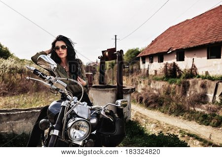 Beautiful Motorcycle Brunette Woman With A Classic Motorcycle (cinema Bleach Bypass Effect)