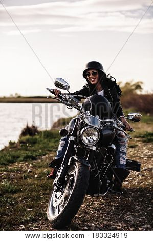 Beautiful Motorcycle Brunette Woman With A Classic Motorcycle (cinema Bleach Bypass Effect)
