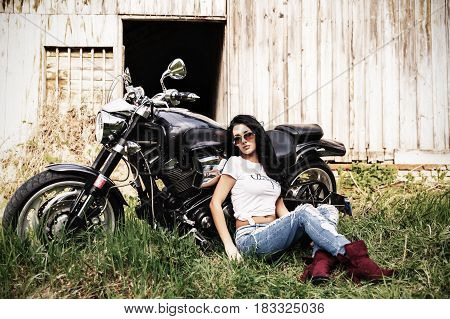 Beautiful Motorcycle Brunette Woman With A Classic Motorcycle (cinema Bleach Bypass Effect)