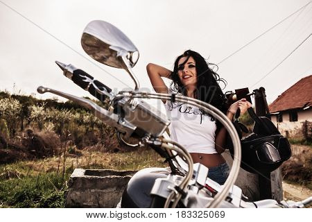Beautiful Motorcycle Brunette Woman With A Classic Motorcycle (cinema Bleach Bypass Effect)