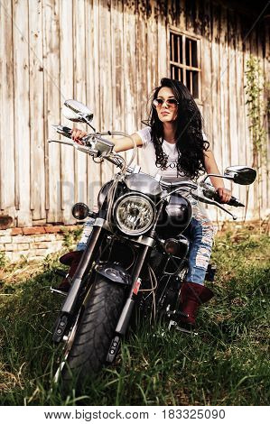 Beautiful Motorcycle Brunette Woman With A Classic Motorcycle (cinema Bleach Bypass Effect)