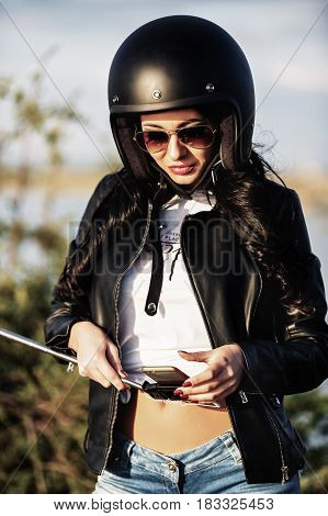 Beautiful Motorcycle Brunette Woman With A Classic Motorcycle (cinema Bleach Bypass Effect)