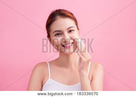 Healthy Fresh Asian Girl Removing Makeup From Her Face With Cotton Pad.