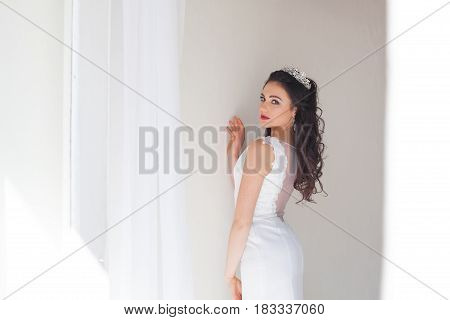 Portrait of bride wedding dress Crown curls hairstyle