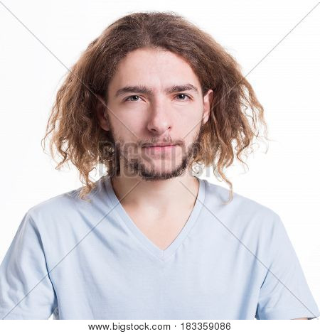 Distrustful and suspicious man. Skepticism facial expression. Doubtful guy grimacing on white isolated studio background, portrait