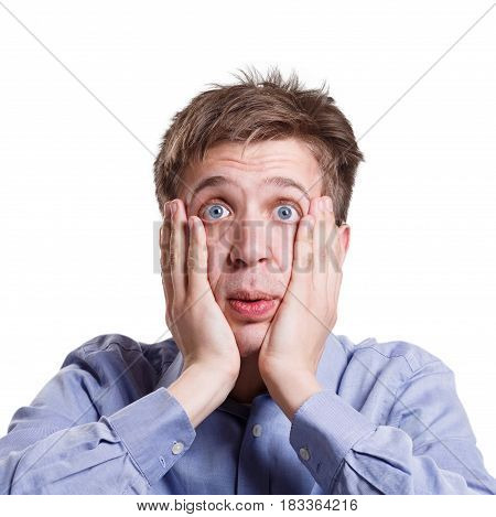 Shocking news. Shocked man emotional, expressing amaze on face, standing on white isolated background, studio shot