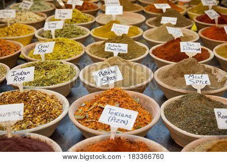 Spice market. Assortment of different colorful powder seasoning. Spices and nuts at the market in the old city Jerusalem.