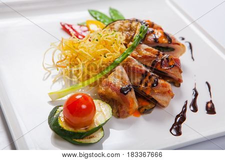 Delicious Chicken Rolls With Cheese And Bacon On A Plate Close-up. Horizontal
