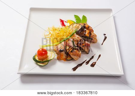 Delicious Chicken Rolls With Cheese And Bacon On A Plate Close-up. Horizontal