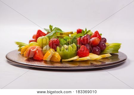 Mixed Fruit Platter With Assorted Fruits On A White Background