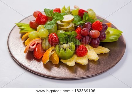 Mixed Fruit Platter With Assorted Fruits On A White Background