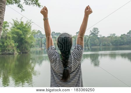 Happy woman feeling free in a beautiful nature - outdoor concept