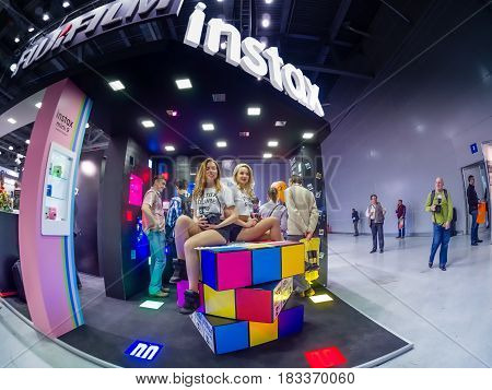 MOSCOW RUSSIA - APRIL 21 2017: Booth of Fujifilm company for promotion Instax cameras at PhotoForum 2017 trade show and exhibition in Moscow Russia on April 21 2017.