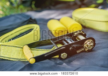 yellow Equipment for slackline Slackline sling next to the machine and protection for the tree