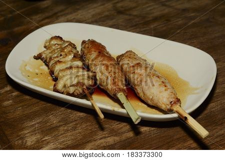 Japanese Chicken Meatballs And Pork Meatballs On Dish