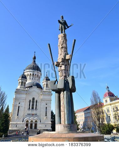 CLUJ NAPOCA ROMANIA - 04.01.2017: Archdiocesan Cathedral and Avram Iancu statue landmark architecture