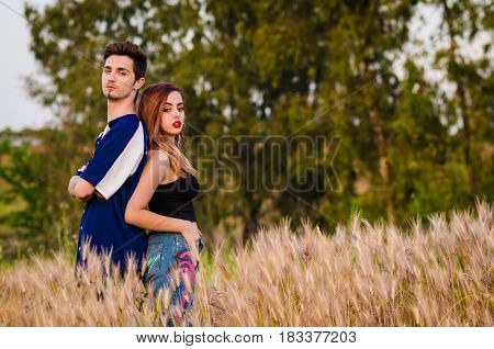 Portrait of a young couple in summer clothes outdoo