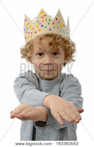 portrait of blond little boy with a crown on his head on white