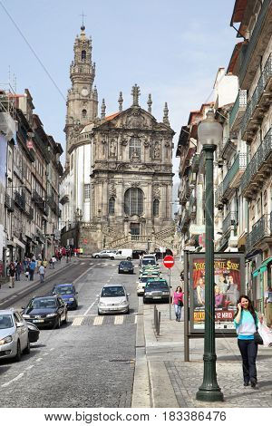 Porto, Portugal - May 12, 2012: Old street (Rua dos Clerigos) and Clerigos Church in downtown of Porto