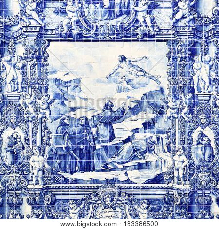 Porto, Portugal - May 13, 2012: Traditional portuguese tilework azulejo on outer wall of the Capela Das Almas De Santa Catarina church in Porto