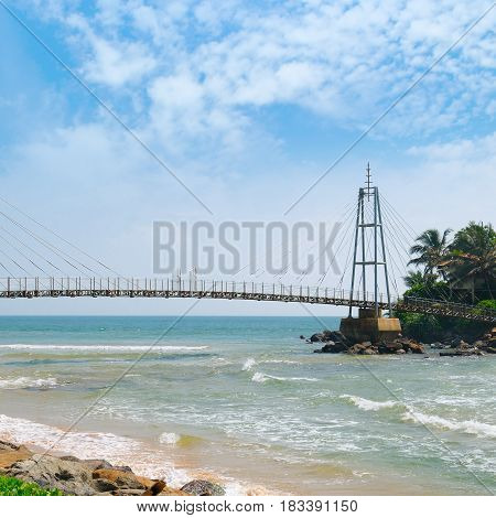 Bridge to the island with a Buddhist temple Matara Sri Lanka