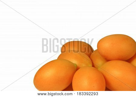 Closed up Heap of Vibrant Yellow Ripe Marian Plums Isolated on White Background