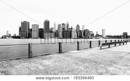 Manhattan skyline in cloudy day, black and white photography, view from Brooklyn Bridge Park, Pier 5, New-York City, USA