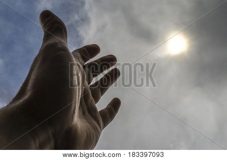 gives a hand to the sky with a request for the help