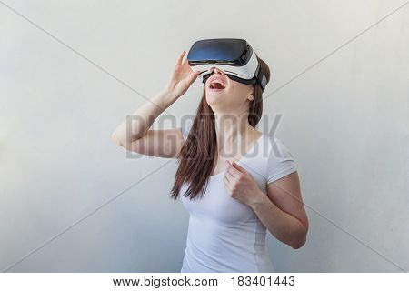 Smile happy young woman using the virtual reality headset on white background