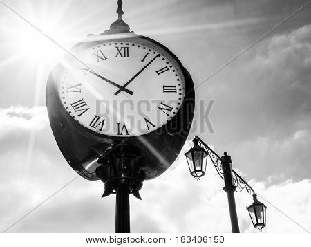Bratislava city clock in sunshine, black and white