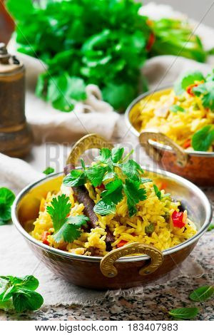 microwave biriyani. in copper bowl. selective focus