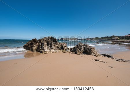 Scenic beach in the touristic village of Comillas Cantabria Spain.