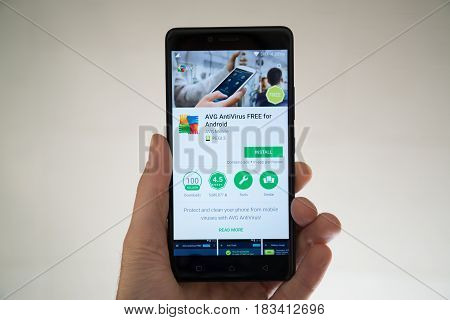 Paris, France, april 22, 2017: AVG free antivirus application on google play store on smartphone