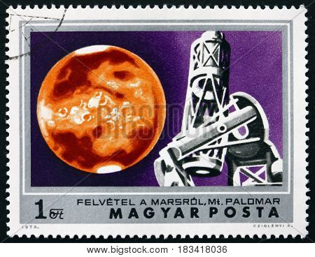 HUNGARY - CIRCA 1974: a stamp printed in Hungary shows Mars and Mt. Palomar Observatory Exploration of Mars circa 1974