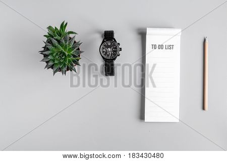 business plan with to do list and watch in management set on gray office table background top view mockup