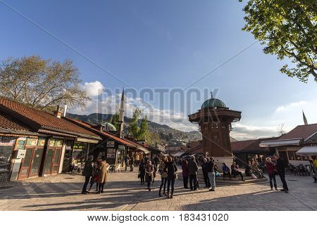 SARAJEVO BOSNIA HERZEGOVINA - APRIL 17 2017: Sebilj fountain on Bacarsija district in the afternoon. This fountain is considered to be one of the greatest landmarks of the Ottoman oart of Sarajevo