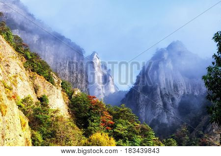 Early morning clouds hanging over Yandangshan or Yandang mountains in China in Zhejiang province.