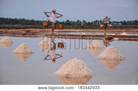 People Working On Salt Field In Cambodia