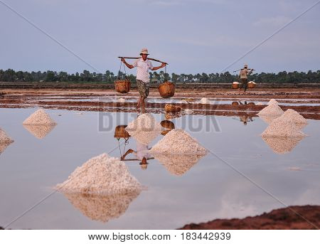 People Working On Salt Field In Cambodia
