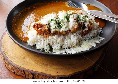 Japanese curry rice fried pork on wooden background