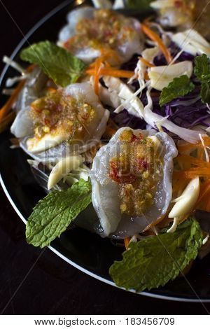 raw prawns with Thai spicy sauce on top.