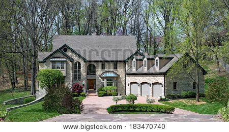 Beautiful Stone Home in Woods in Springtime
